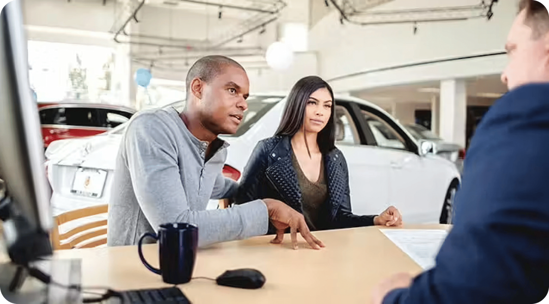 Customer and dealer discussing car purchase at Tricity Auto, a used cars dealership Waterloo, ON